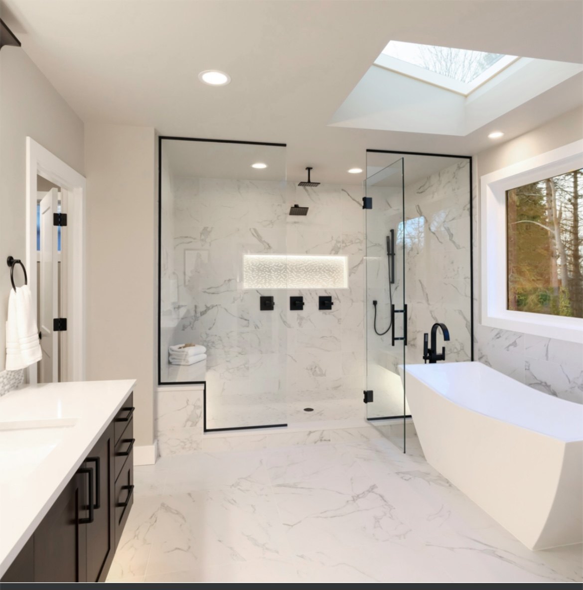 Primary bathroom with large walk-in shower and freestanding tub