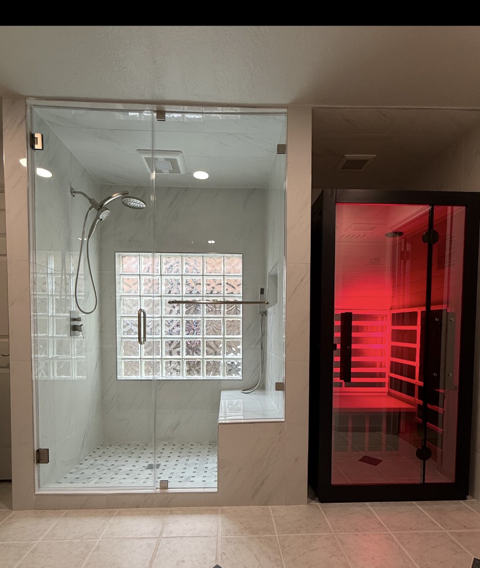 Trewick Custom Renovations bathroom with glass walk-in shower and private sauna